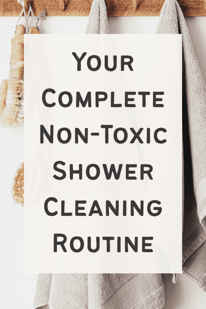 spray bottle of daily diy shower cleaner sitting on a bathroom shelf