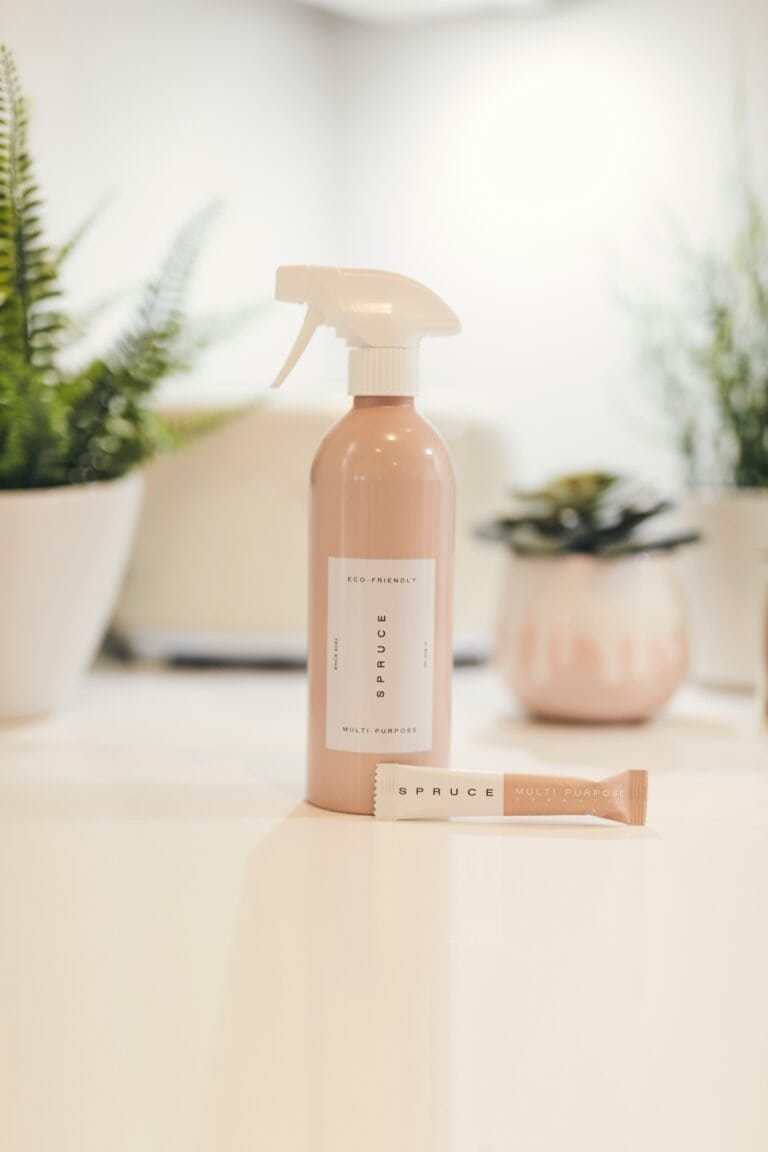 Zero waste cleaning supplies including reusable cloths and glass bottles